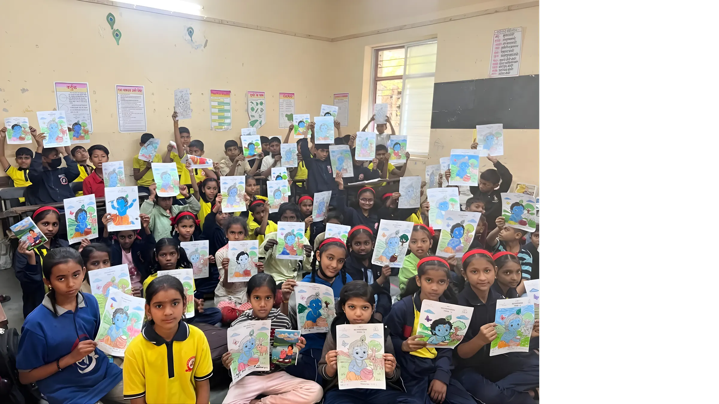 Schoolchildren hold up their coloured drawings of Bal Krishna after a Geeta cla  se ion.
